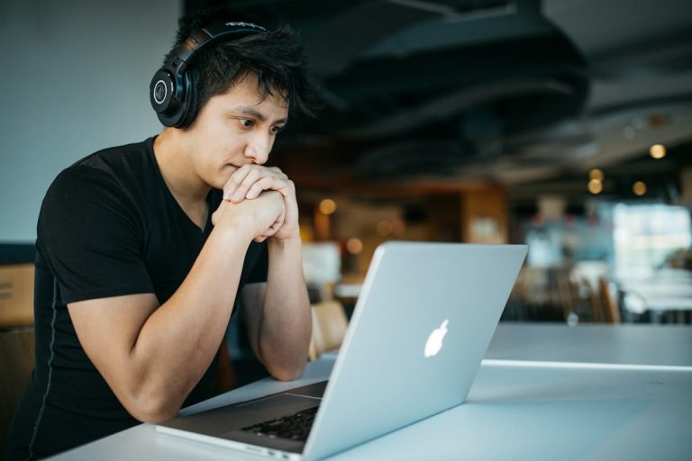 Student planning flexible online university study with a laptop